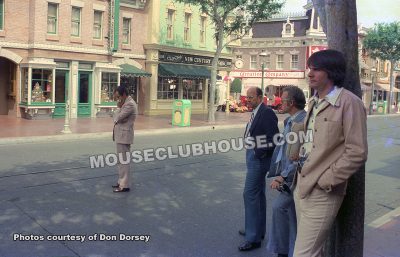 Bob Jani stands on Main Street in Disneyland to hear the America on Parade soundtrack mix (1975)